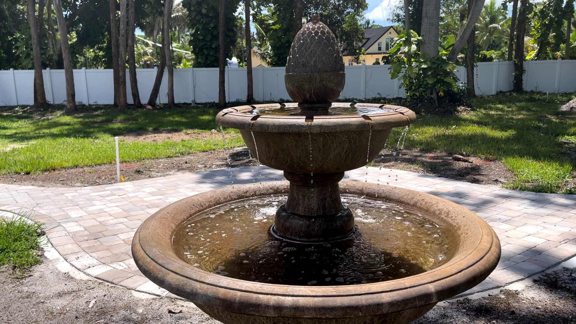 Angled view of the Wiltshire Fountain with water cascading from the upper basin into the lower basin