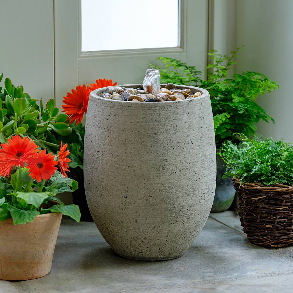 Bebel Pebble Fountain outdoor garden fountain in Greystone finish