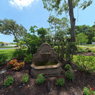 Front view of the Andalusia cast stone fountain with water flowing into the large basin