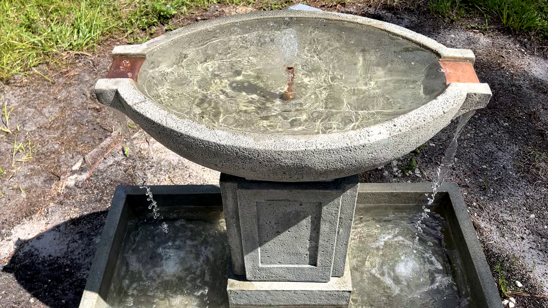 Overhead view of the Austin Fountain featuring the circular upper basin and four evenly spaced copper spillways