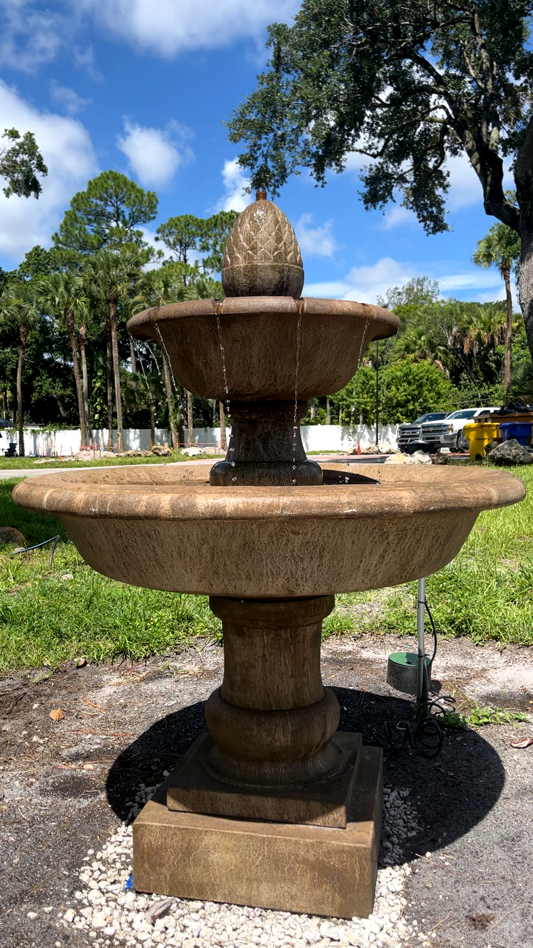 Front view of the Wiltshire Fountain highlighting the elegant two-tier cast stone design and flowing water