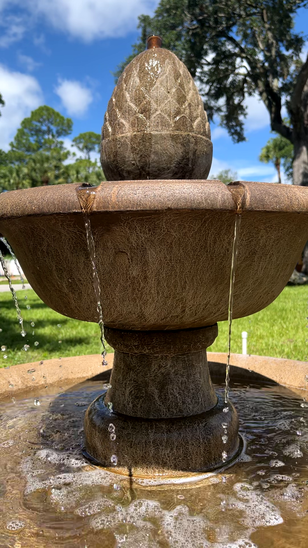 Close-up of the Wiltshire Fountain's upper basin and decorative finial with cascading water streams