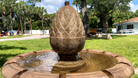 Close-up of the Wiltshire Fountain's handcrafted decorative finial with water gently flowing over the surface