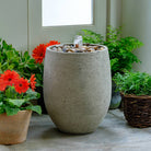 Bebel Pebble Fountain outdoor garden fountain in Greystone finish