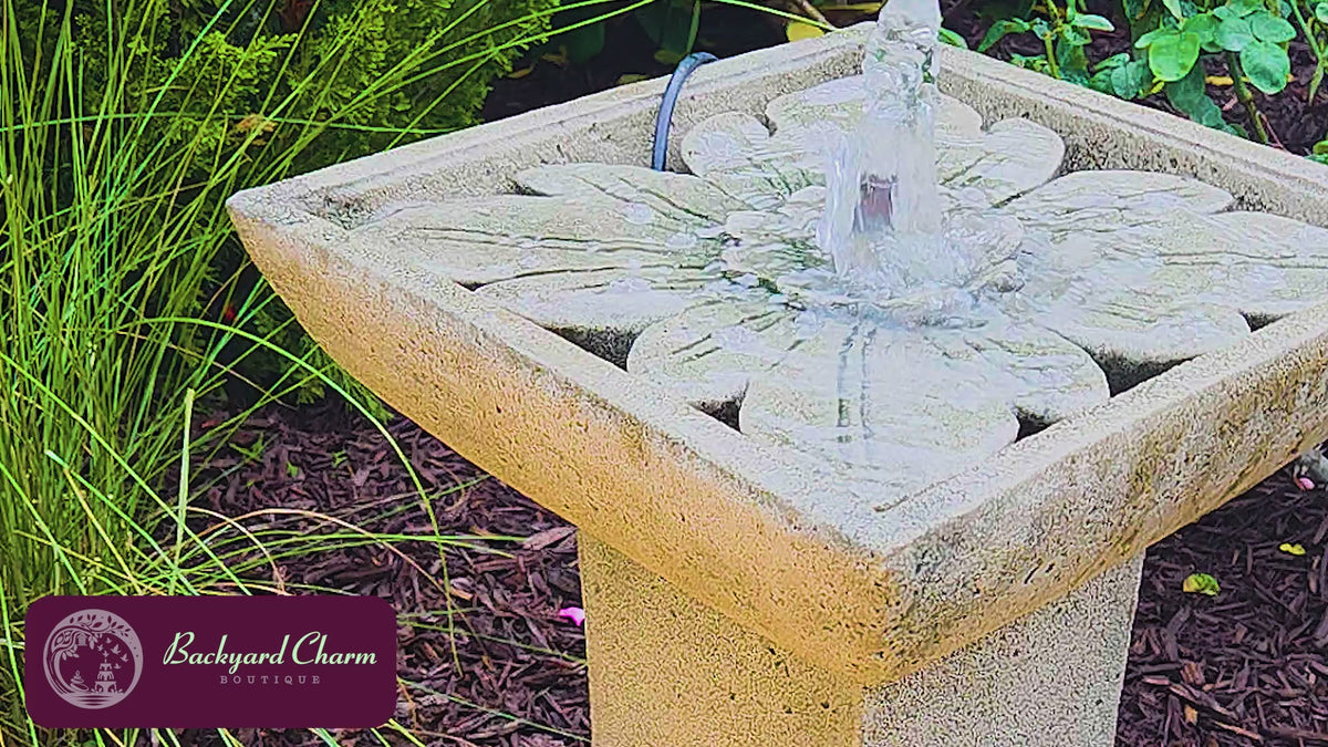 Andra cast stone fountain with flowing water and natural water sound in an outdoor setting