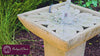 Andra cast stone fountain with flowing water and natural water sound in an outdoor setting