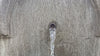 Andalusia cast stone fountain with flowing water installed in a landscaped garden