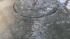 Girona Fountain with gentle bubbling water in a landscaped outdoor setting