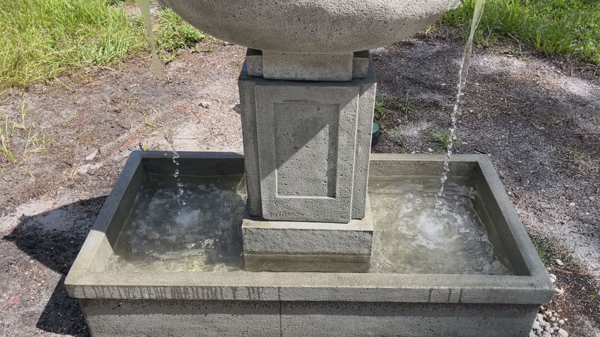 Stone outdoor garden fountain collection with flowing water, showcasing the handcrafted fountains available at Backyard Charm Boutique.